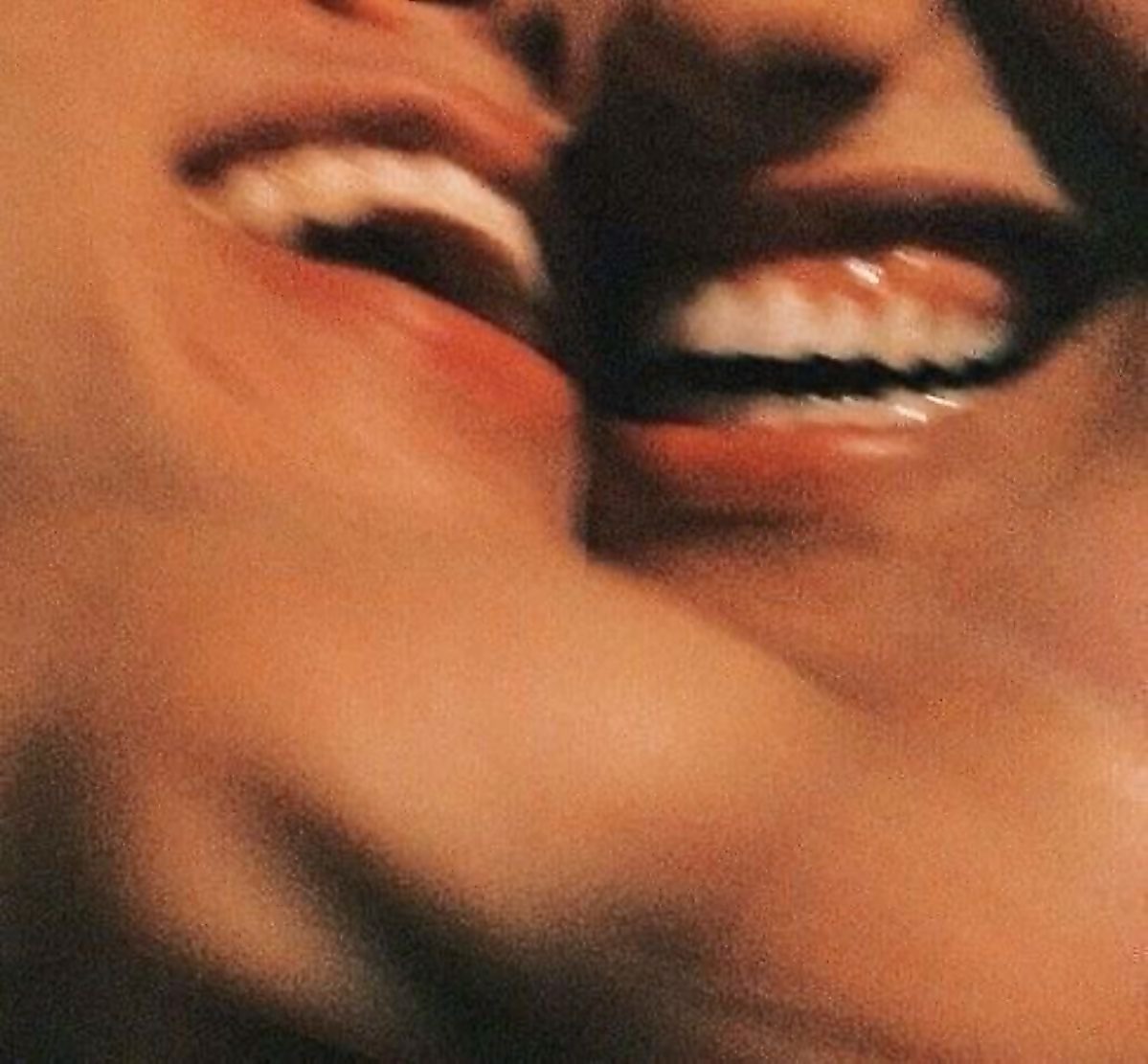 An intimate, soft-focus close-up of a couple